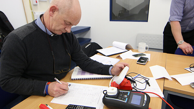 Pat testing by a delegate in a classroom